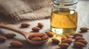 almond oil and almonds 1296x728 1